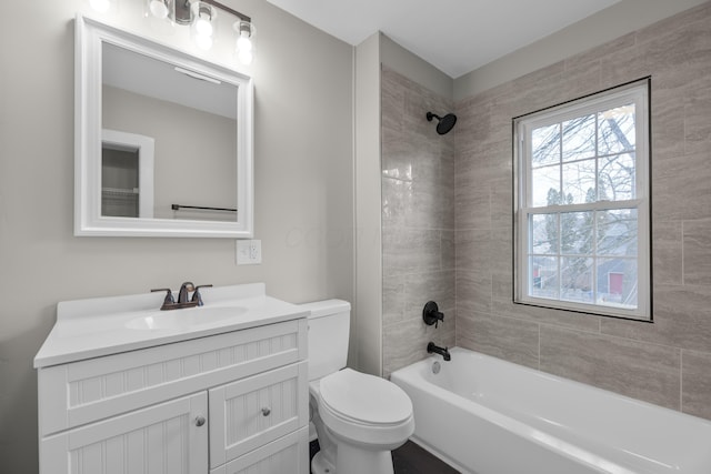 bathroom with shower / bathtub combination, vanity, and toilet