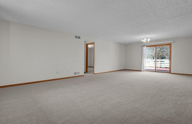 unfurnished room with visible vents, baseboards, light colored carpet, and a chandelier