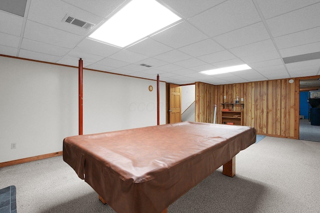 playroom with visible vents, carpet floors, and wooden walls