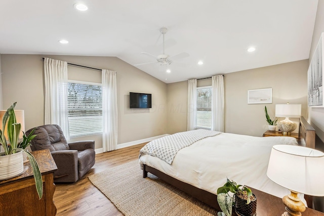 bedroom featuring lofted ceiling, recessed lighting, a ceiling fan, baseboards, and light wood-type flooring