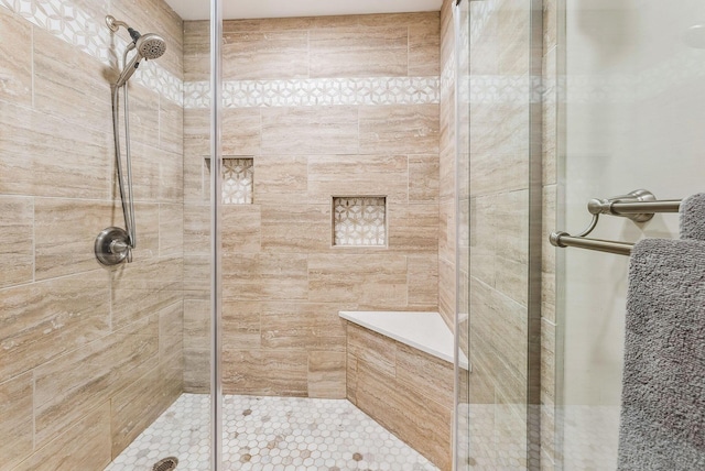 full bathroom with a shower stall