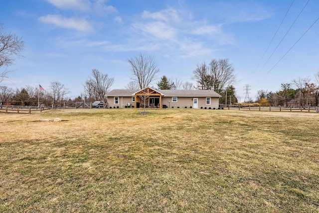 view of front of property with a front yard and fence