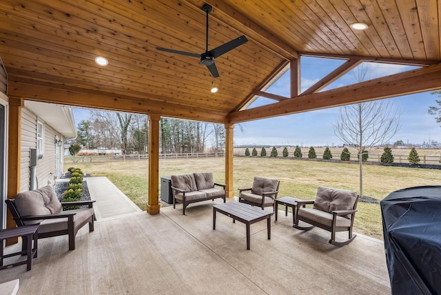 view of patio featuring outdoor lounge area, fence, a gazebo, and a rural view