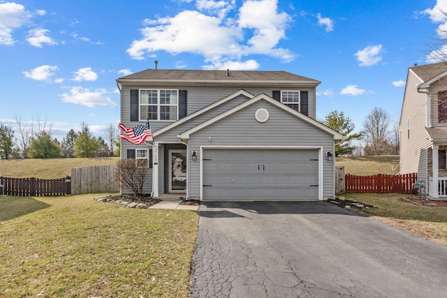 traditional home with aphalt driveway, a front yard, fence, and an attached garage