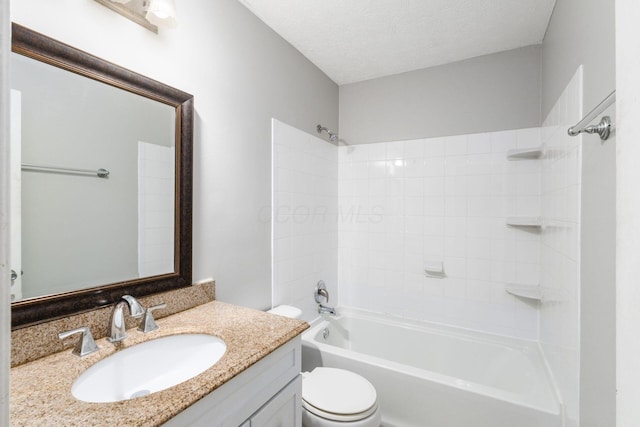 full bathroom with shower / washtub combination, a textured ceiling, toilet, and vanity