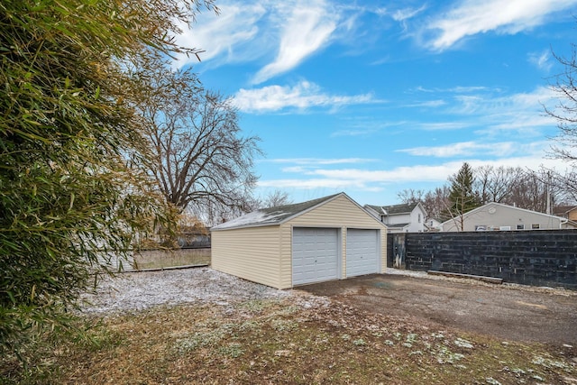 detached garage with fence