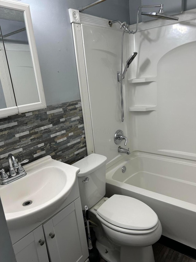 full bath with toilet, shower / bath combination, and vanity