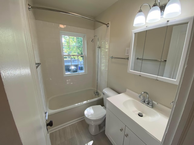 full bath with  shower combination, vanity, and toilet