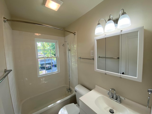 full bathroom featuring shower / bathtub combination, vanity, and toilet