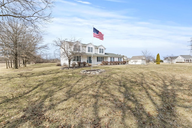 view of front of property featuring covered porch and a front lawn