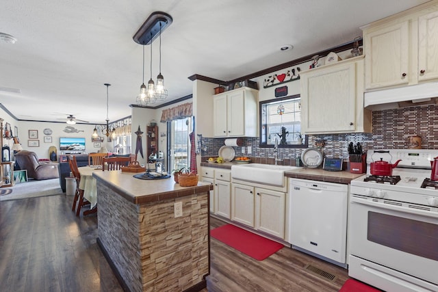 kitchen with dark wood finished floors, white appliances, custom range hood, and a sink