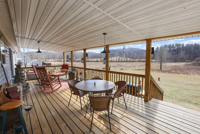 wooden terrace featuring a yard