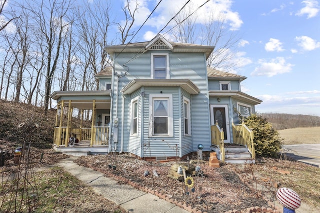 victorian-style house featuring a porch