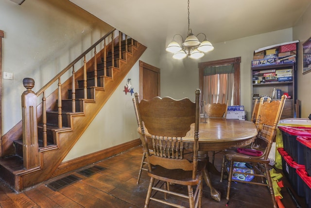 dining space featuring a notable chandelier, wood-type flooring, visible vents, stairway, and baseboards