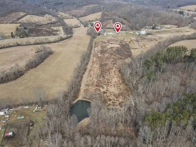 birds eye view of property with a rural view and a water view