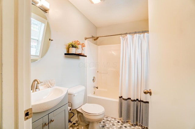 bathroom featuring vanity, toilet, and shower / bath combo