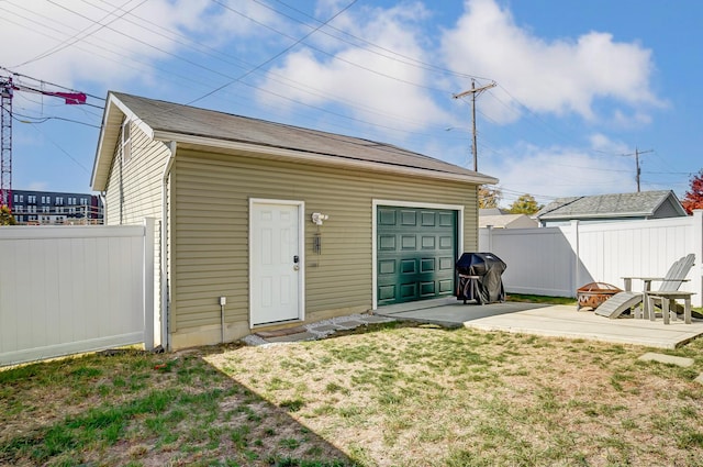 view of outbuilding with fence