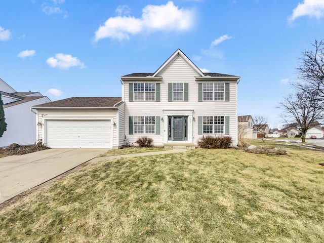 view of front facade with an attached garage, driveway, and a front lawn