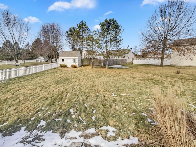 view of yard featuring an outbuilding and a fenced backyard