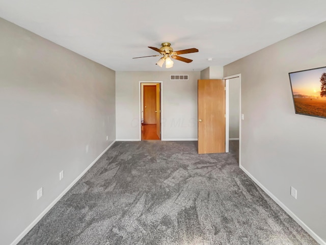 unfurnished bedroom featuring ceiling fan, carpet flooring, visible vents, and baseboards