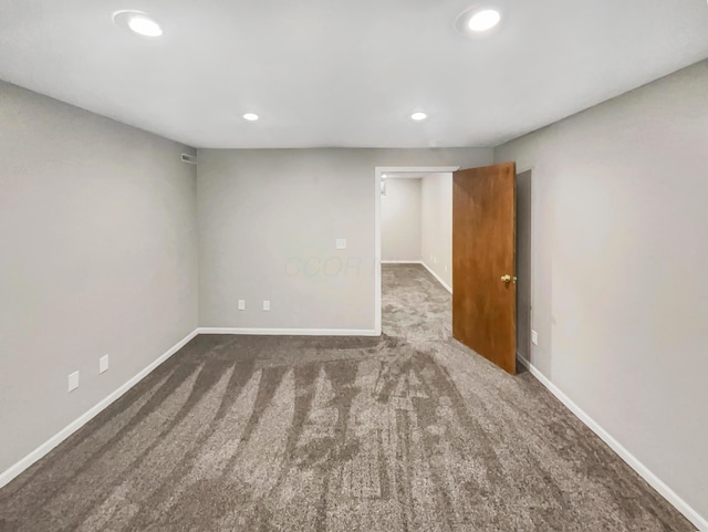 carpeted spare room with recessed lighting and baseboards