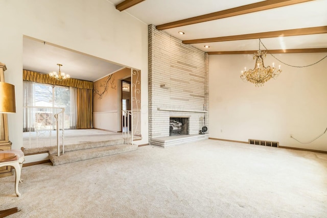 unfurnished living room with a chandelier, carpet floors, a fireplace, visible vents, and beam ceiling