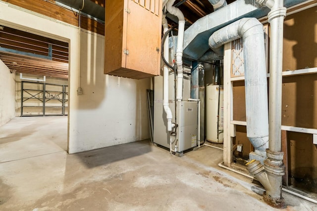 utility room with water heater and heating unit