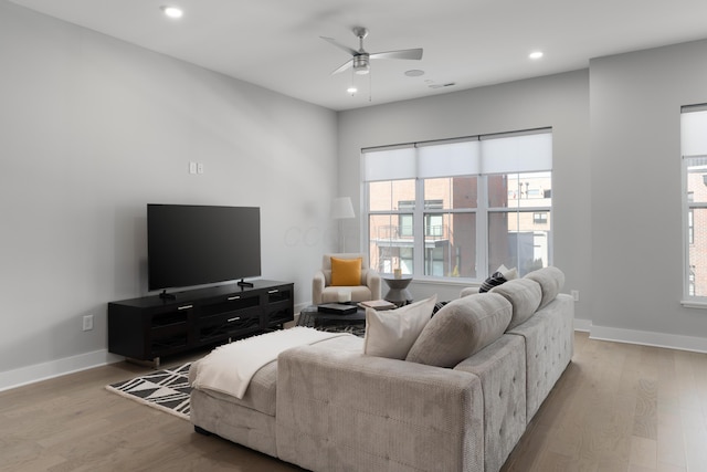 living room featuring visible vents, ceiling fan, baseboards, recessed lighting, and wood finished floors