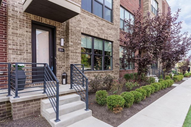 property entrance with brick siding