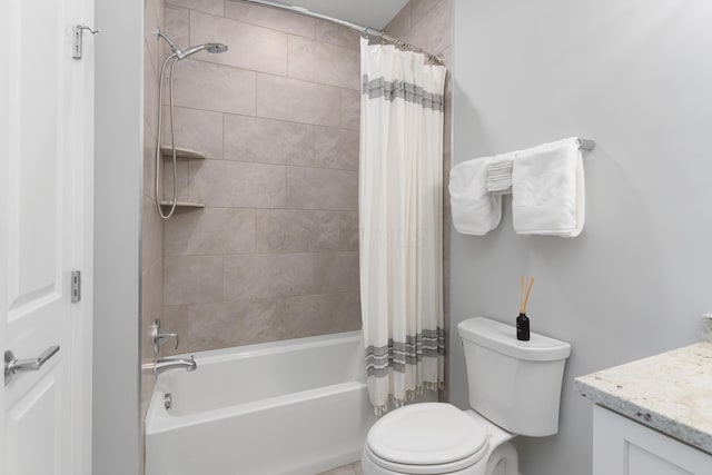 bathroom with shower / bath combination with curtain, toilet, and vanity