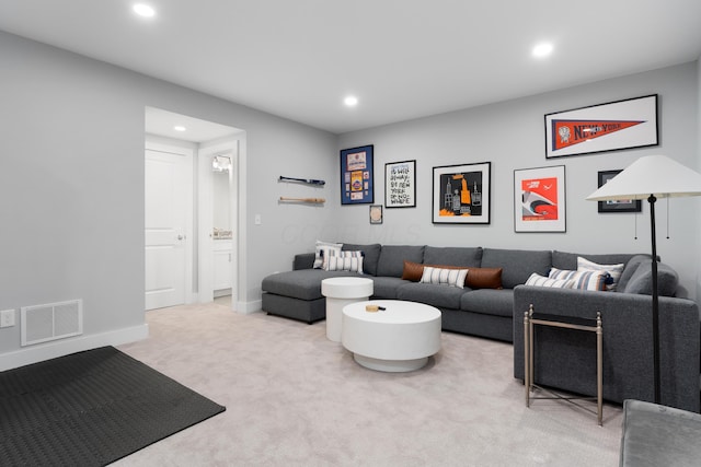 carpeted living area featuring visible vents, recessed lighting, and baseboards