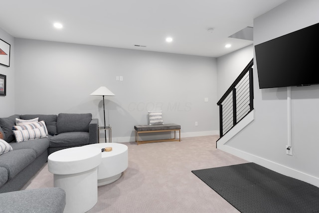 living room with stairway, recessed lighting, baseboards, and carpet floors