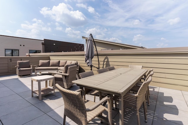 view of patio / terrace featuring outdoor dining space and an outdoor living space