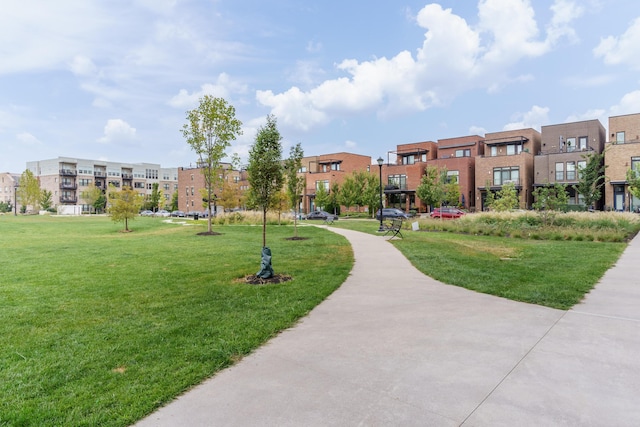 surrounding community featuring a residential view and a lawn