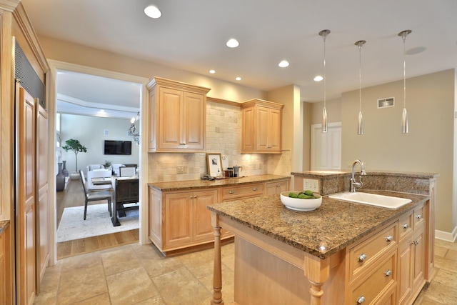 kitchen with visible vents, light brown cabinets, a sink, tasteful backsplash, and recessed lighting