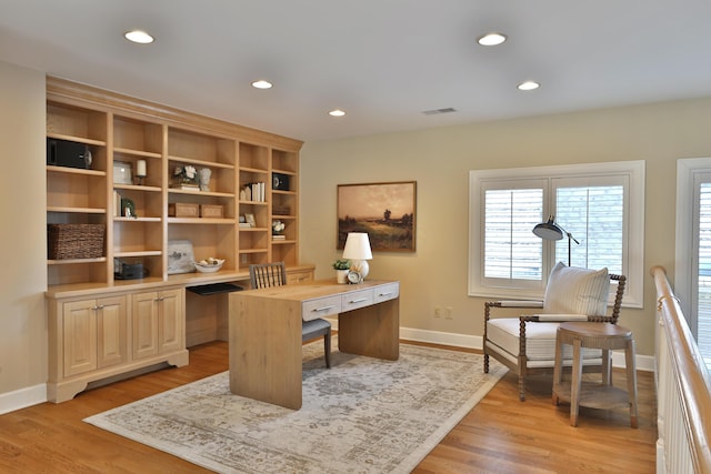 home office featuring recessed lighting, visible vents, light wood-type flooring, and baseboards