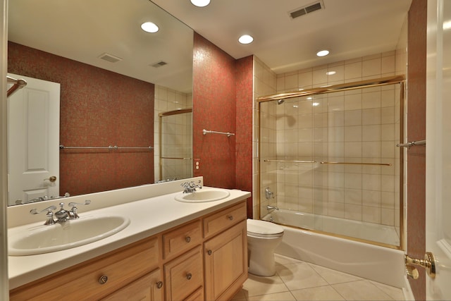 bathroom featuring tile patterned flooring, visible vents, and a sink