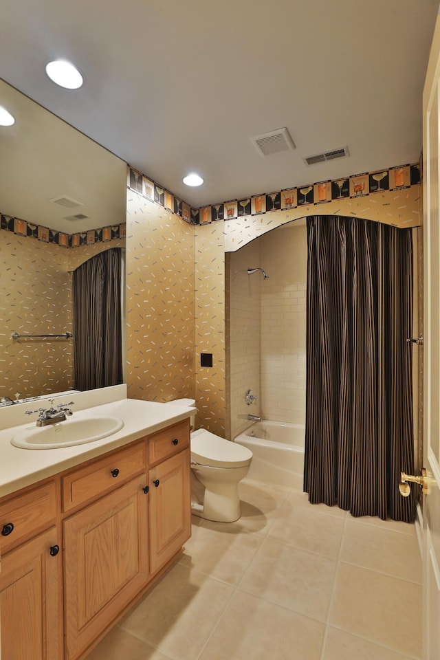 full bathroom featuring vanity, visible vents, tile patterned flooring, shower / tub combination, and toilet