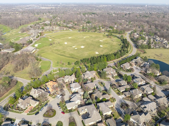 birds eye view of property with view of golf course and a residential view