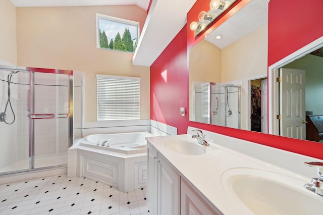 bathroom with vaulted ceiling, a stall shower, a sink, and a bath