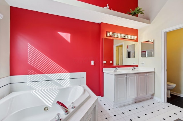 full bath with a whirlpool tub, toilet, and double vanity