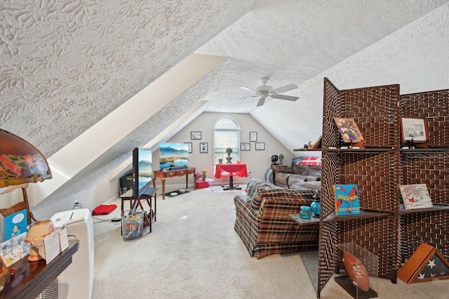 interior space featuring carpet floors, ceiling fan, vaulted ceiling, and a textured ceiling