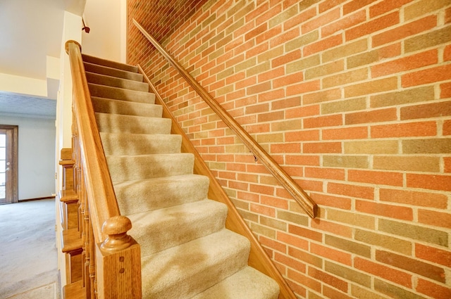 stairway with brick wall