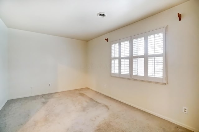 carpeted empty room with visible vents