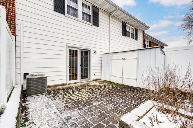 back of house featuring a patio area and cooling unit