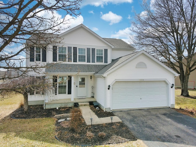 view of front facade with aphalt driveway, covered porch, a shingled roof, and an attached garage