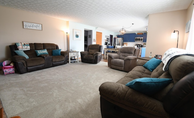 living room with carpet flooring and a textured ceiling