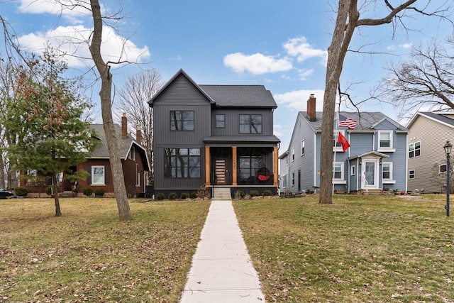 view of front of property with entry steps, a porch, and a front yard