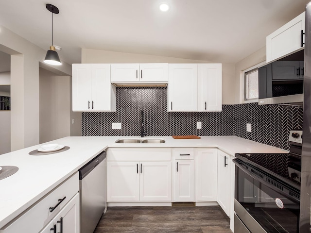 kitchen featuring dishwasher, electric range oven, hanging light fixtures, light countertops, and a sink