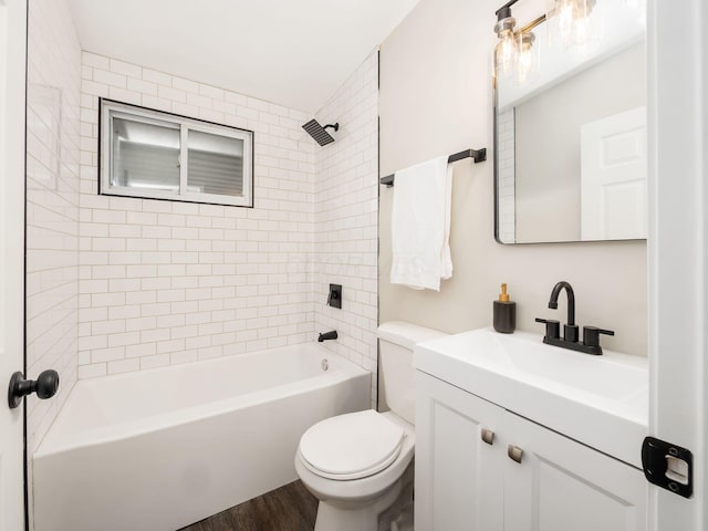 bathroom featuring  shower combination, vanity, wood finished floors, and toilet